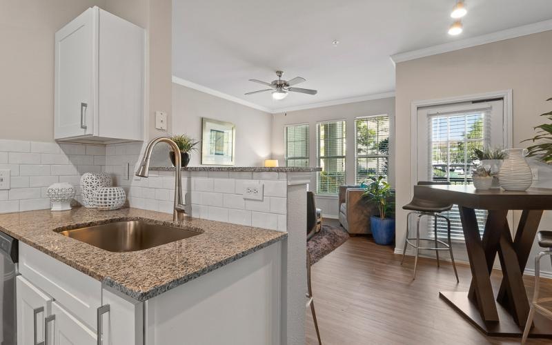 a kitchen with a marble countertop