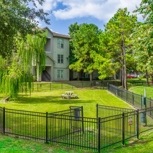 Settle into comfort at Taylor at Copperfield a fenced in dog park